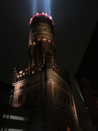 Low angle view of tower at night