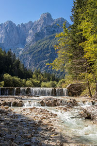 Scenic view of waterfall against sky