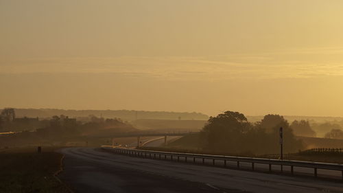 Empty road at sunset