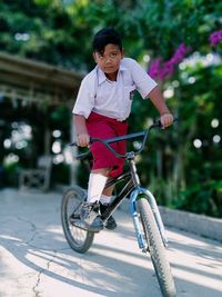 Boy riding bicycle