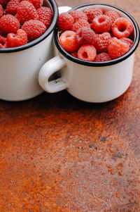 Close-up of strawberries in cups on table