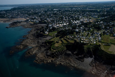 High angle view of townscape by sea