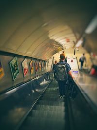 Full length of woman standing by railing