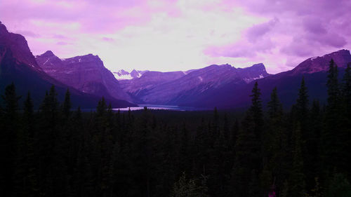 Scenic view of mountains against cloudy sky