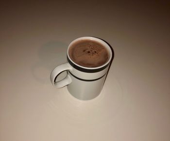 High angle view of coffee cup on table