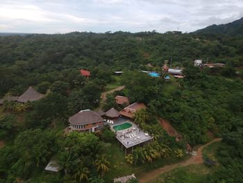 High angle view of houses and trees against sky