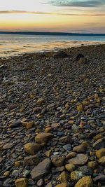 Scenic view of sea against sky at sunset