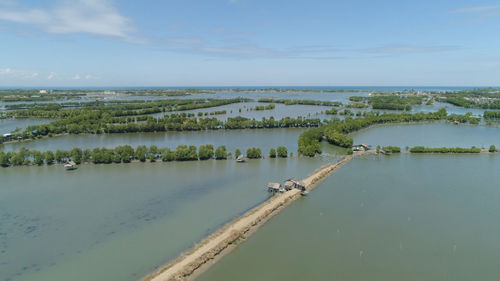 Town in cultivated mangroves, ubagan, sto tomas. fish farm with cages for fish and shrimp 