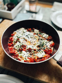 High angle view of shakshuka served in a plate on table