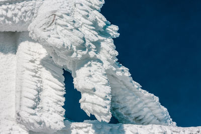 Frozen sea against blue sky