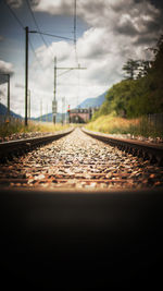 Surface level of railway tracks against sky