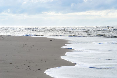 Scenic view of beach against sky
