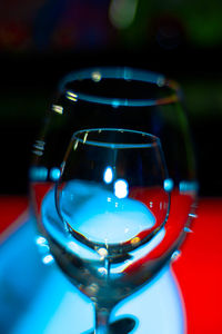 Close-up of illuminated glasses on table