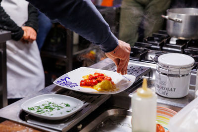 Midsection of man preparing food