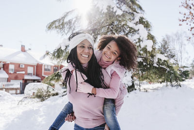 Portrait of smiling woman in snow