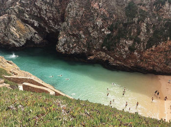 High angle view of rocks on sea shore