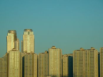 Skyscrapers against clear blue sky