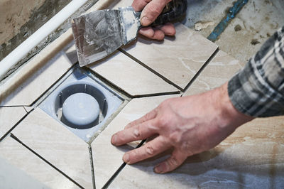 Cropped image of man working on table