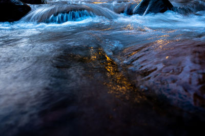 Close-up of water flowing through rocks