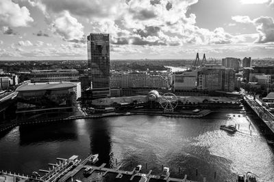 High angle view of river amidst buildings against sky