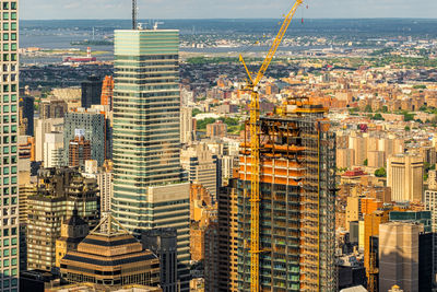 High angle view of buildings in city against sky