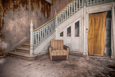 Empty chairs in old building