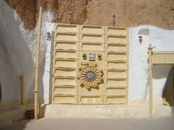 Low angle view of yellow wall of building