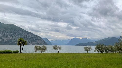 Scenic view of lake and mountains against sky
