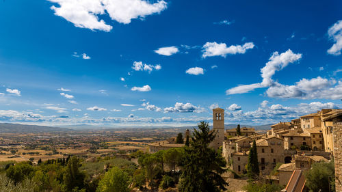 Panoramic view of townscape against blue sky