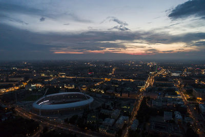 High angle view of buildings in city at sunset