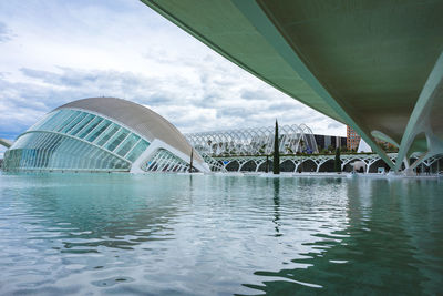 View of bridge over river against cloudy sky