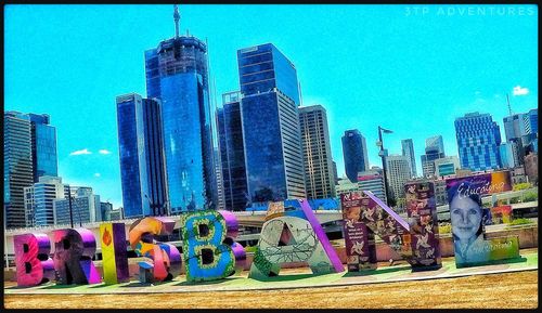 Panoramic shot of modern buildings against sky in city