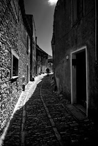 Narrow alley along buildings
