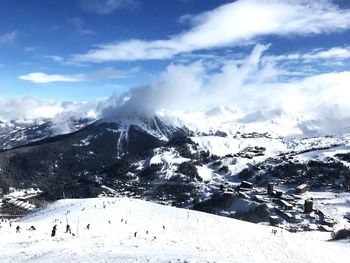 Scenic view of snowcapped mountains against sky