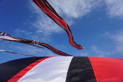 Low angle view of flag against sky