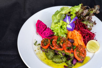 High angle view of fruit salad in plate on table