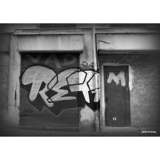 architecture, built structure, building exterior, transfer print, auto post production filter, window, wall - building feature, graffiti, door, house, closed, wall, text, day, no people, building, outdoors, western script, entrance, shutter