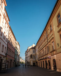 Street amidst buildings against sky