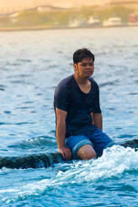 Young man in sea