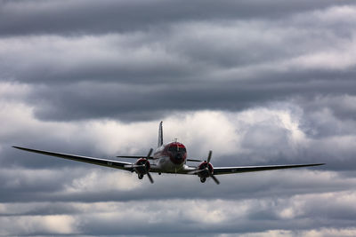 Low angle view of airplane against sky