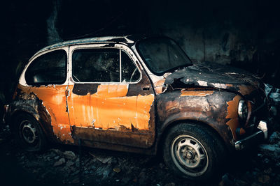 Abandoned car at night