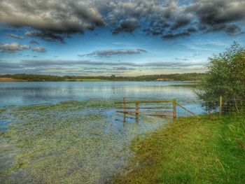 Scenic view of calm lake against clear sky