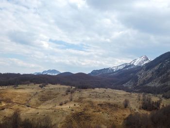 Scenic view of landscape and mountains against sky