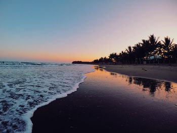 View of beach at sunset