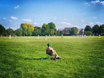 People on field against sky