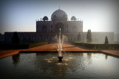 Fountain in front of historical building