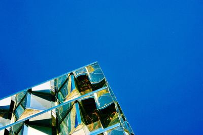 Low angle view of building against blue sky