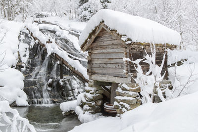 Icicles on snow covered land