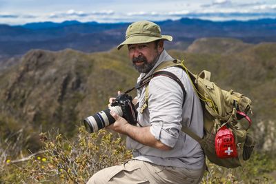 Full length of man wearing hat on land