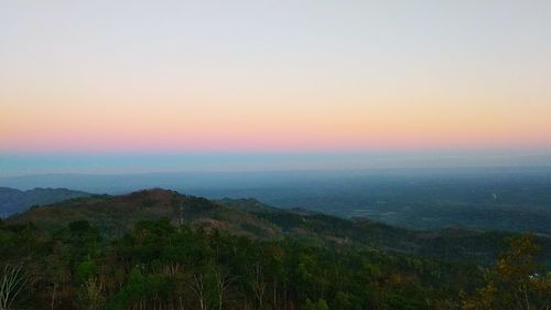 Scenic view of landscape against sky during sunset